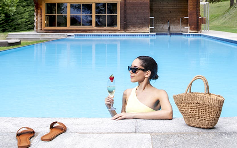 QC Terme Bagni Nuovi outdoor thermal pool with mountain view in Bormio, Italy.