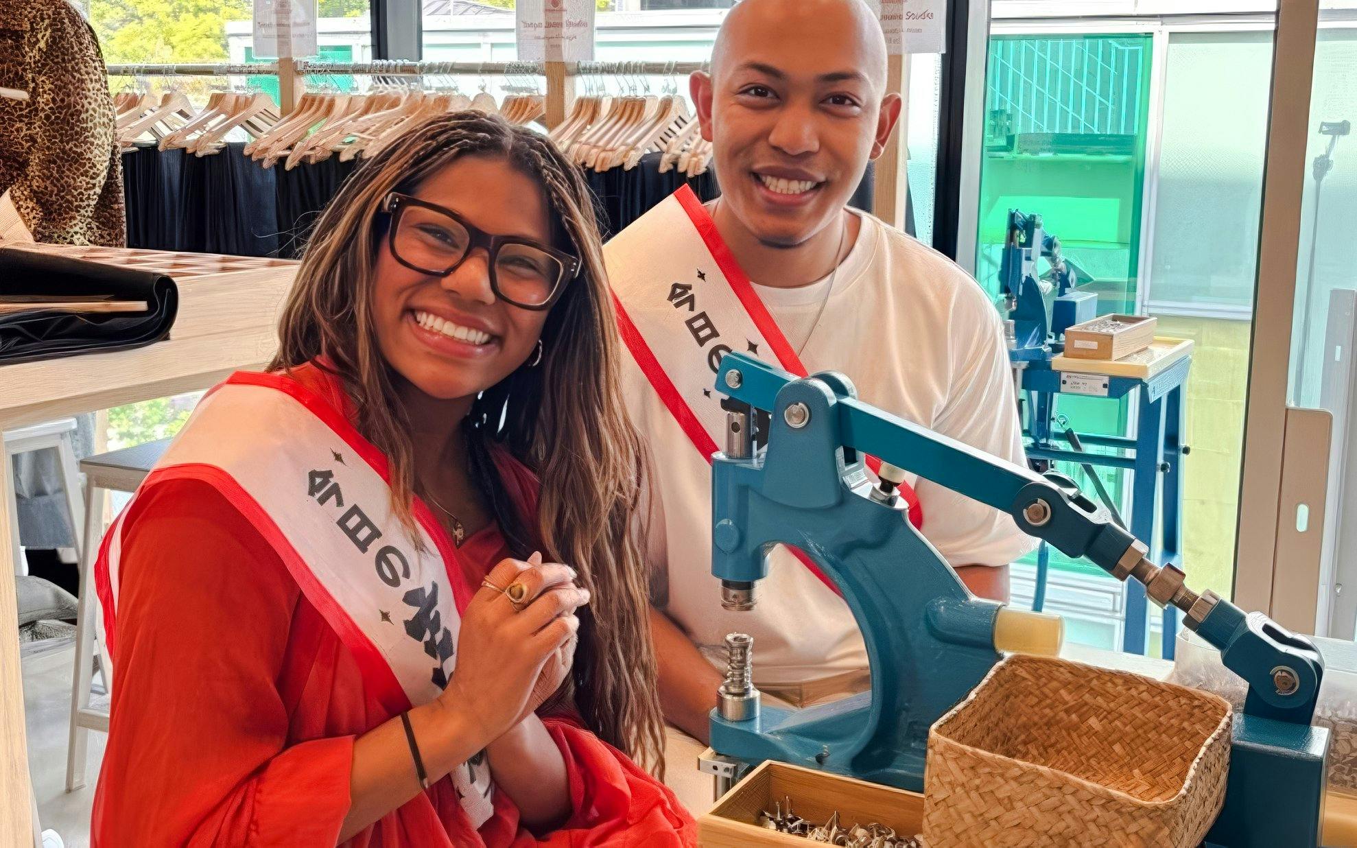 Couple crafting denim jeans at Harajuku workshop in Tokyo.