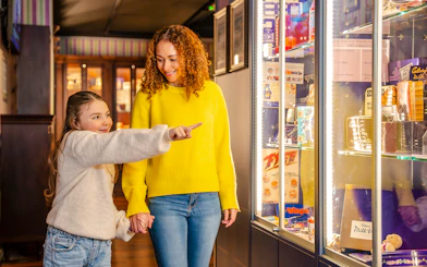 Guests exploring exhibits at the Bourneville Experience, Cadbury World.