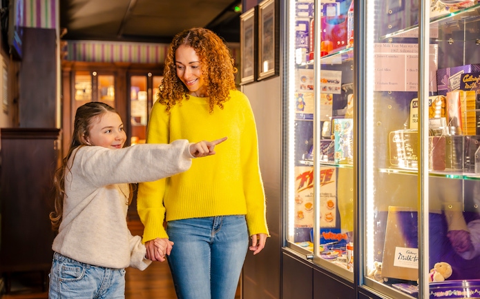 Guests exploring exhibits at the Bourneville Experience, Cadbury World.