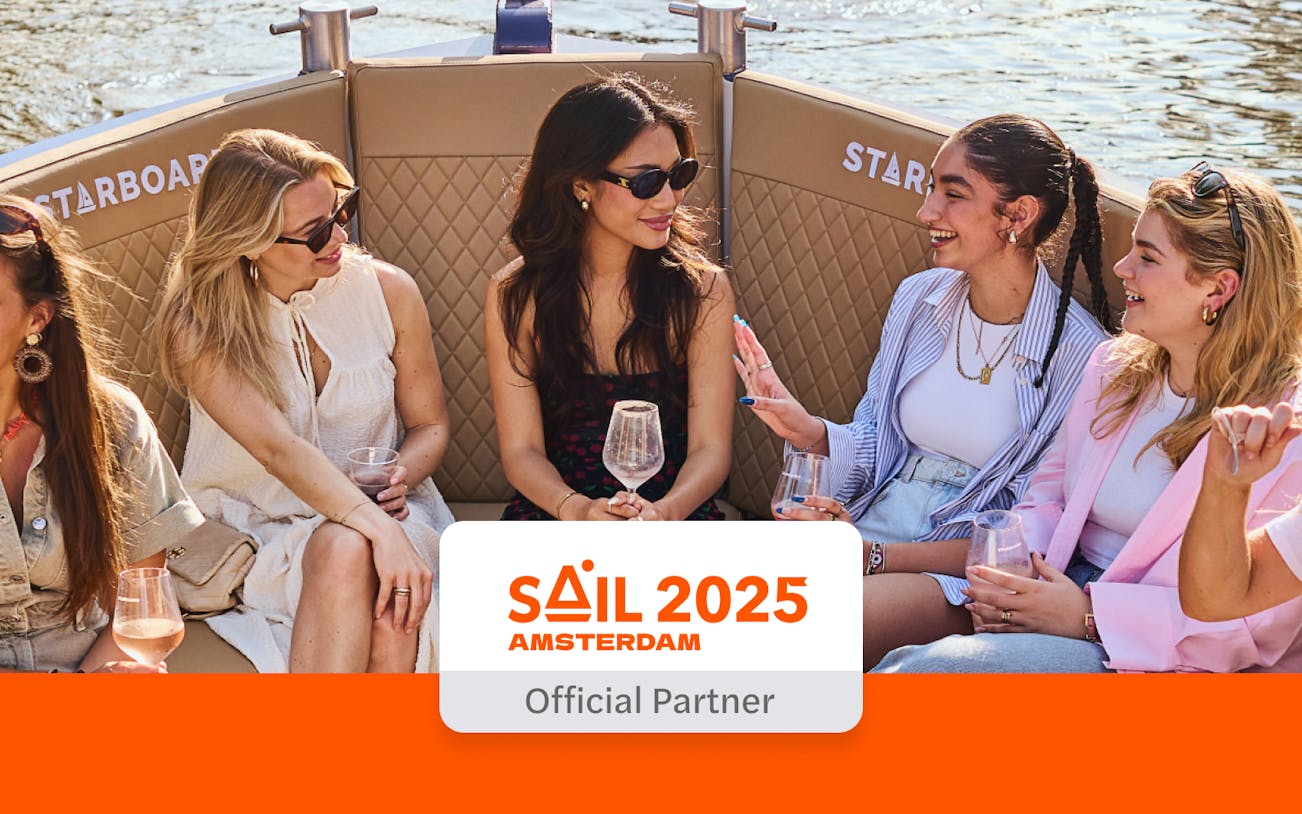 Guests enjoying drinks on the Luxury Canal Cruise in Amsterdam.