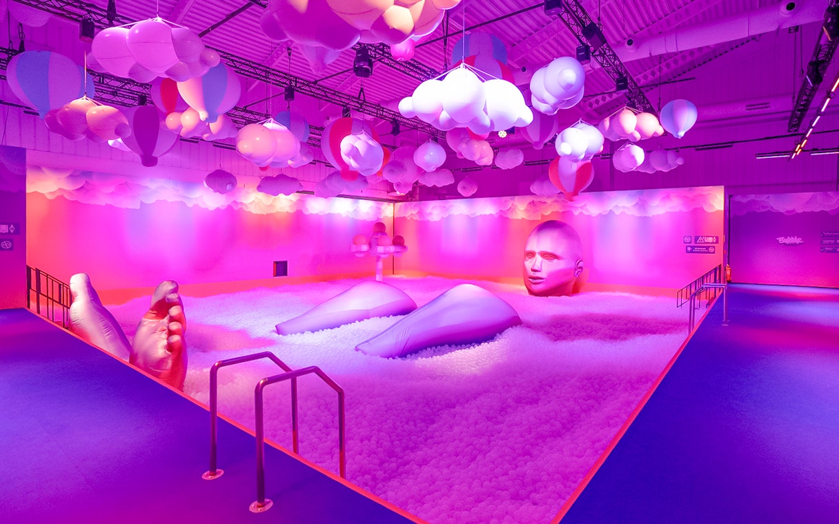 Interactive art installation with large inflatable figures and colorful clouds at Bubble Planet, Washington DC.