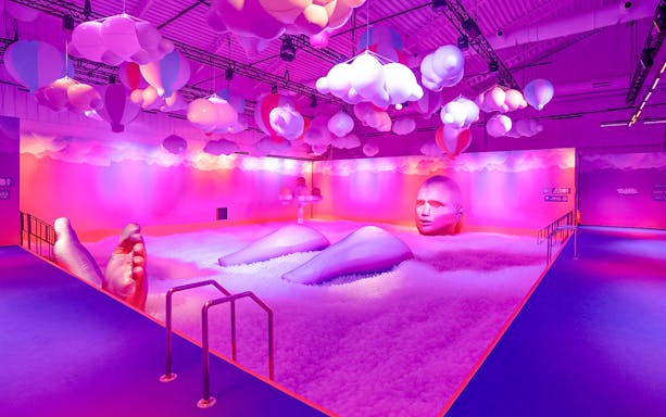 Interactive art installation with large inflatable figures and colorful clouds at Bubble Planet, Washington DC.