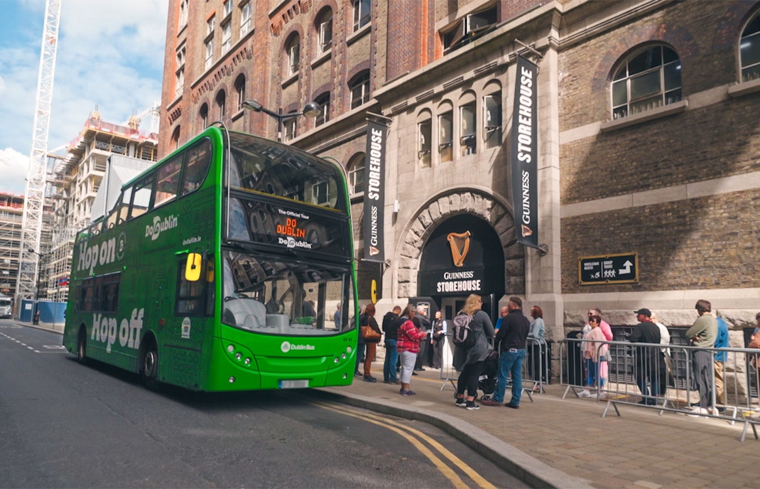 Hop-on hop-off bus near Guinness Storehouse, Dublin, with live guide and museum entry.