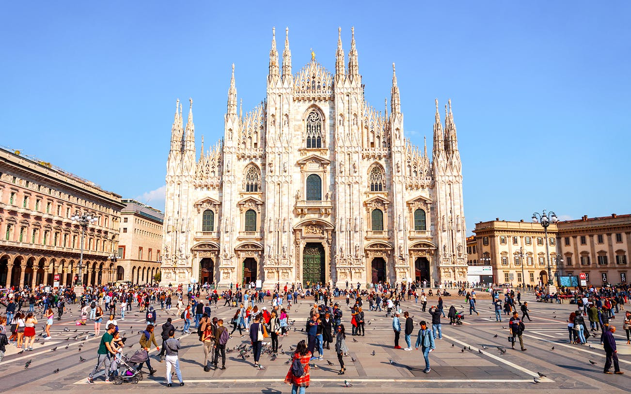 Duomo di Milano Cathedral exterior with people in Piazza del Duomo, Milan.