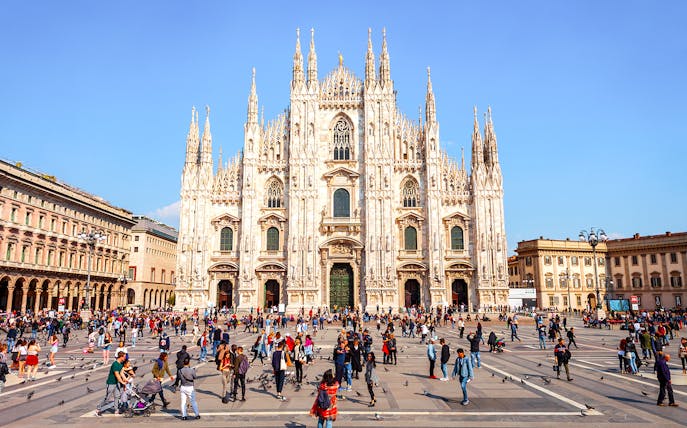 Duomo di Milano Cathedral exterior with people in Piazza del Duomo, Milan.