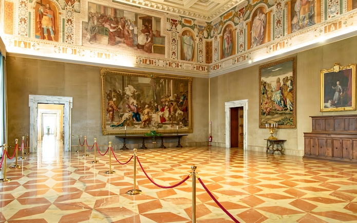 Interior of St. John Lateran with frescoes and ornate ceiling, Rome.