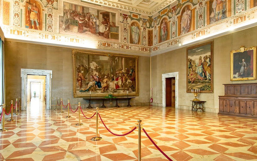 Interior of St. John Lateran with frescoes and ornate ceiling, Rome.