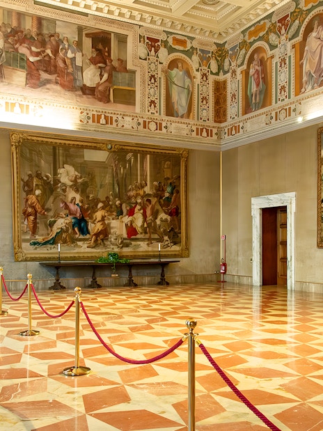 Interior of St. John Lateran with frescoes and ornate ceiling, Rome.