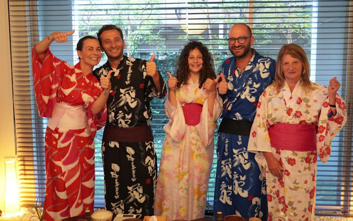 Group in kimonos enjoying a tea ceremony experience in Tokyo.