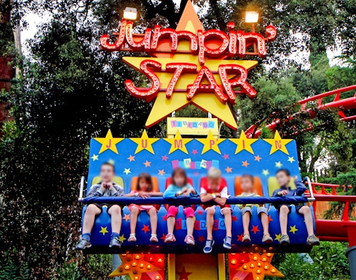 Children on the Granota ride at Tibidabo Amusement Park, Barcelona.