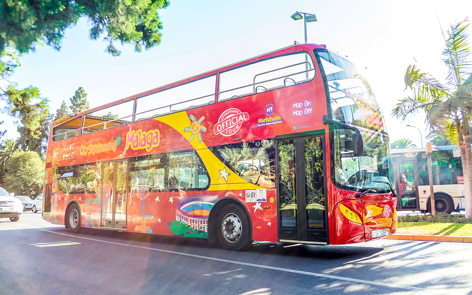 City Sightseeing hop on hop off bus touring Malaga street.