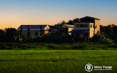 Traditional workshop buildings surrounded by greenery at Driftwood Village, Hoi An.