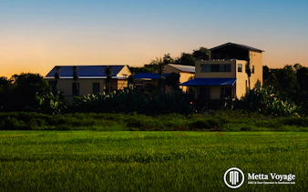 Traditional workshop buildings surrounded by greenery at Driftwood Village, Hoi An.