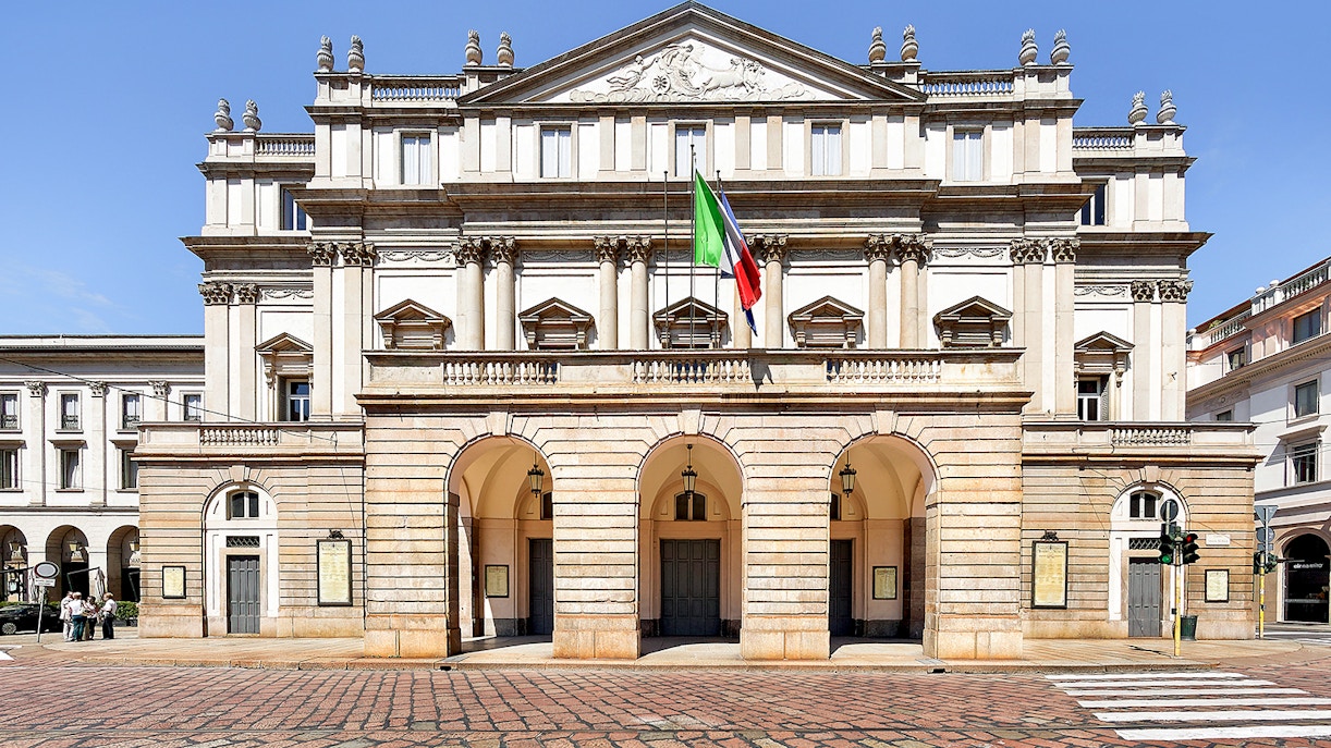 La Scala Theatre exterior with tourists in Milan, Italy.