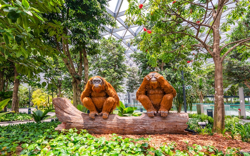 Topiary orangutan sculptures on a log at Canopy Park, Jewel Changi.