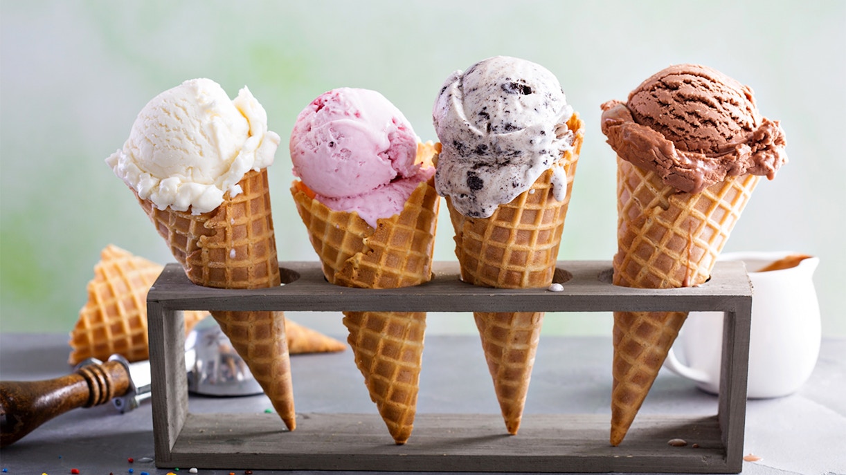Three ice cream cones with different flavors in a row