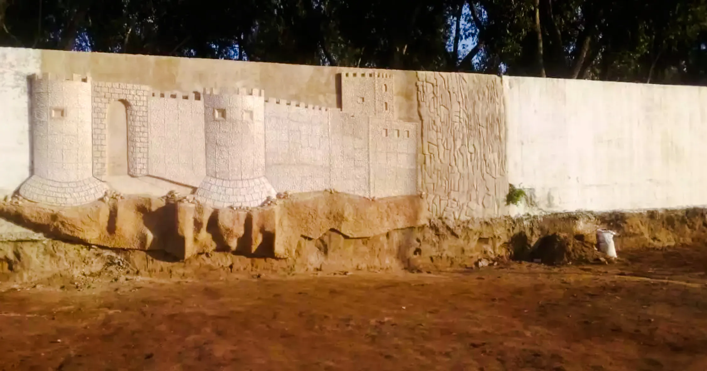 Upcycled wall art resembling a castle in Safi, Essaouira workshop.