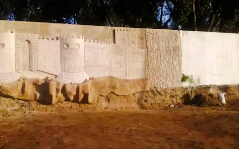 Upcycled wall art resembling a castle in Safi, Essaouira workshop.