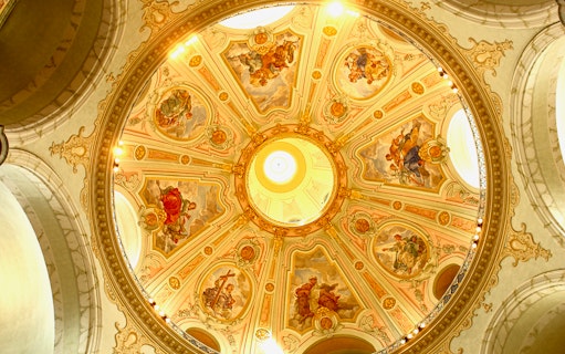 Frauenkirche dome with intricate frescoes during guided gallery tour.