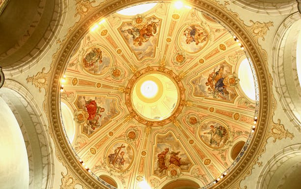 Frauenkirche dome with intricate frescoes during guided gallery tour.