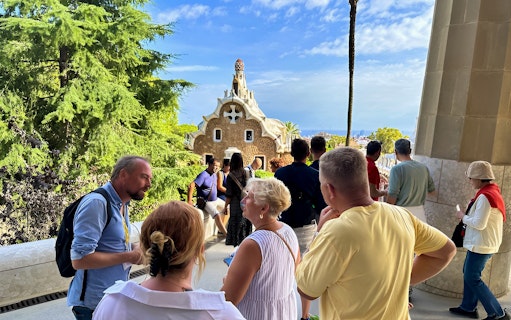 Visitors exploring Park Güell in Barcelona during a guided tour.