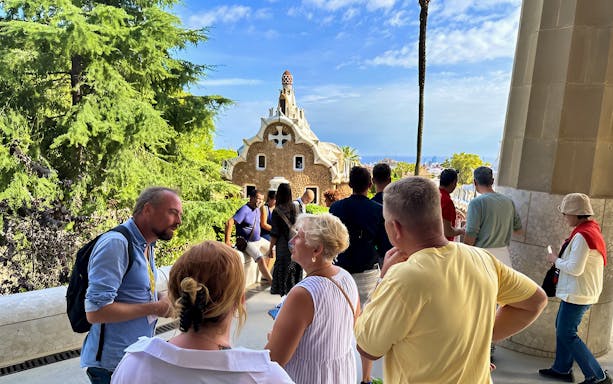 Visitors exploring Park Güell in Barcelona during a guided tour.
