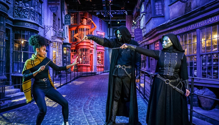 Hogwarts castle illuminated during Dark Arts Halloween event at Harry Potter London tour.