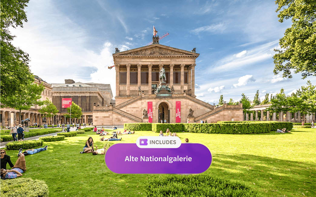 Alte Nationalgalerie in Berlin with visitors relaxing on the lawn.