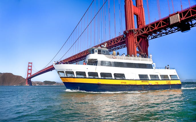 Ferry passing under the Golden Gate Bridge in San Francisco.
