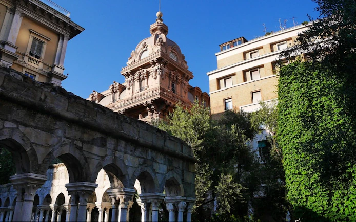 Historic architecture and arches in Genoa, Italy, featured in a self-guided city exploration game.