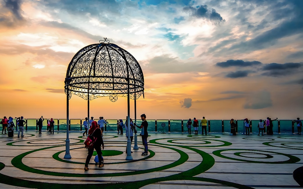 Visitors enjoying sunset views from The Shore Sky Tower observation deck.