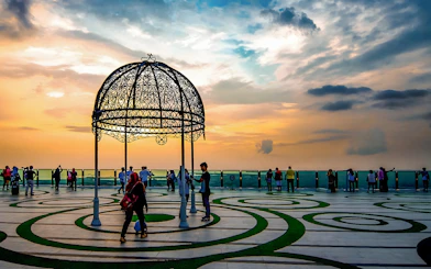 Visitors enjoying sunset views from The Shore Sky Tower observation deck.