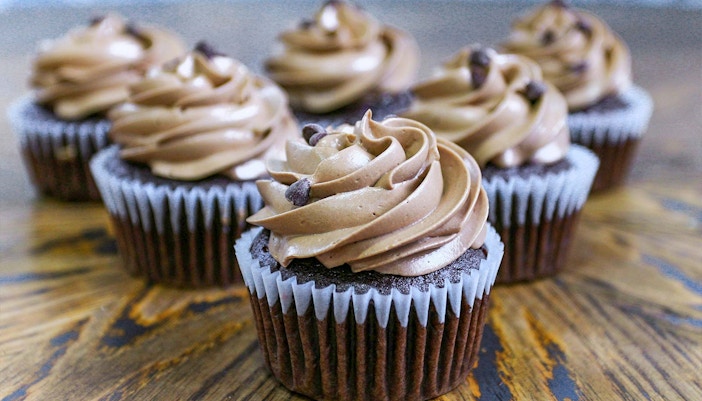 Chocolate cupcakes with swirled frosting at Chocolate Frog Café.