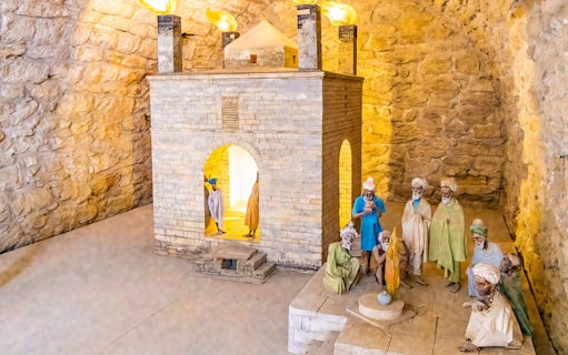 Teshgah Fire Temple interior with stone structure and figures in Azerbaijan.
