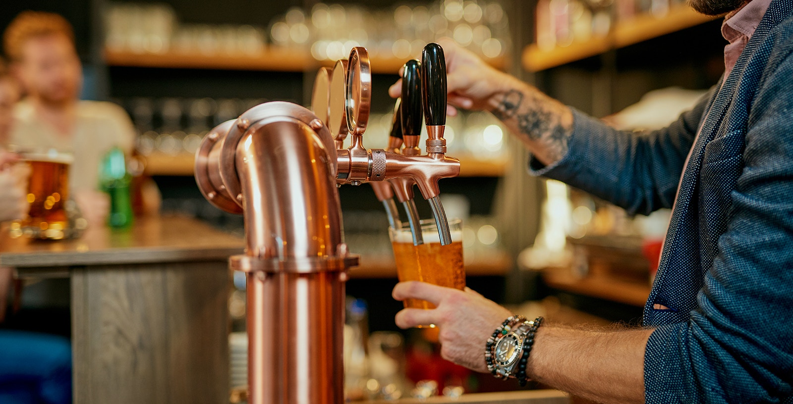 Prague Czech beer tasting experience with glasses of various local brews on a wooden table.