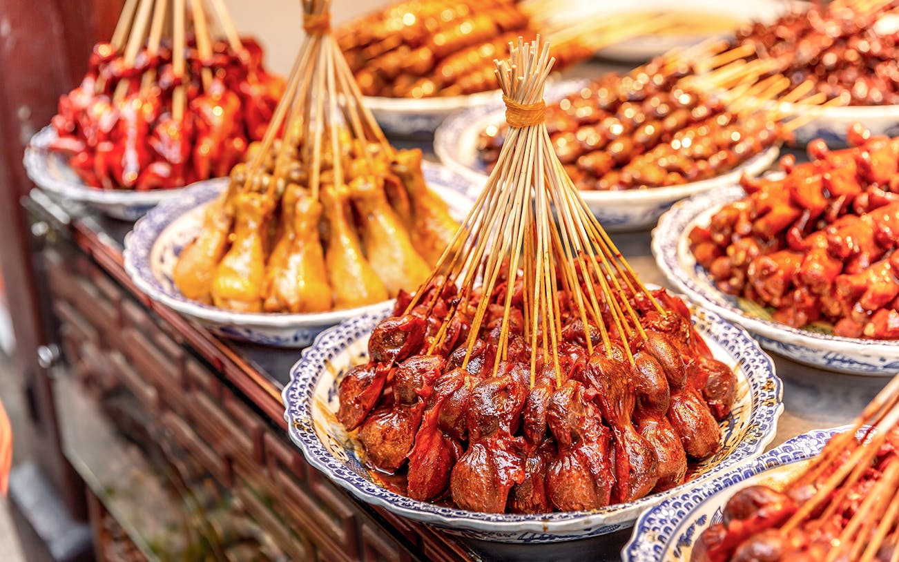 Skewered meats displayed at a street market in Phuket.
