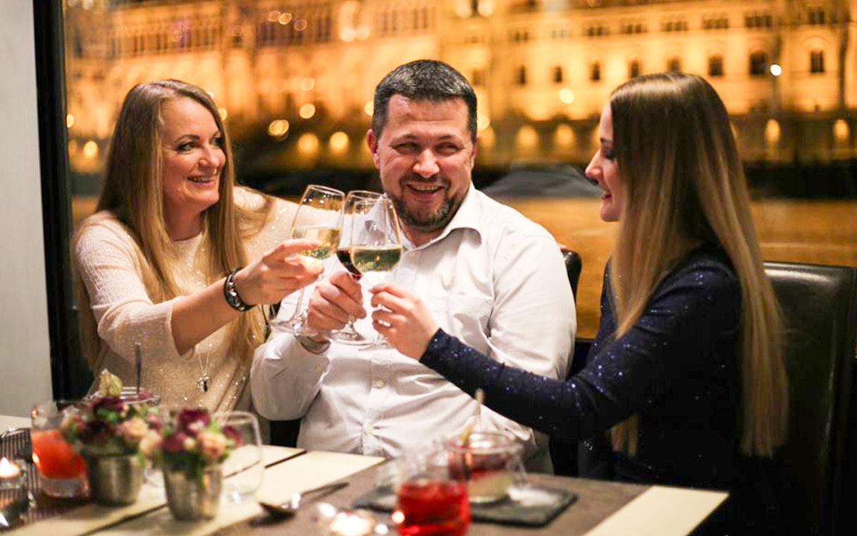 Guests toasting on a Budapest New Year’s Eve cruise.
