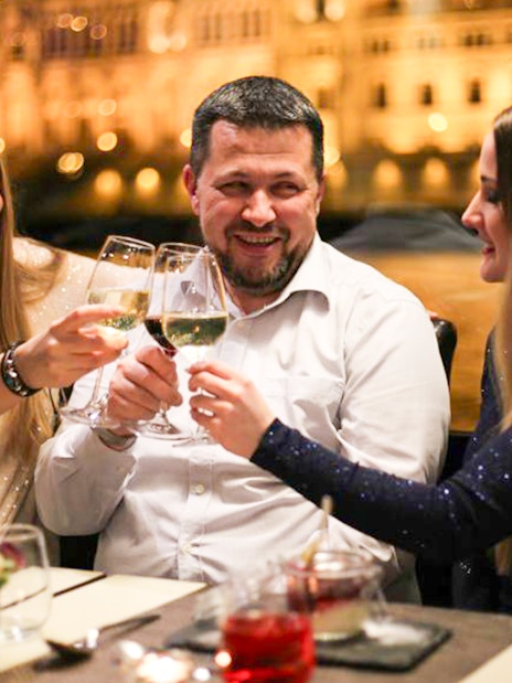 Guests toasting on a Budapest New Year’s Eve cruise.