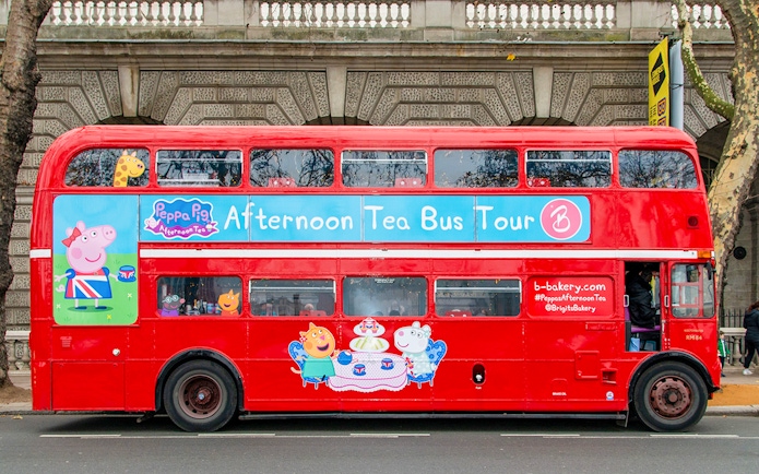 Red double-decker bus for Brigit’s Afternoon Tea Bus Tour with Peppa Pig theme.