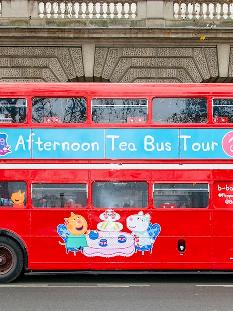 Red double-decker bus for Brigit’s Afternoon Tea Bus Tour with Peppa Pig theme.