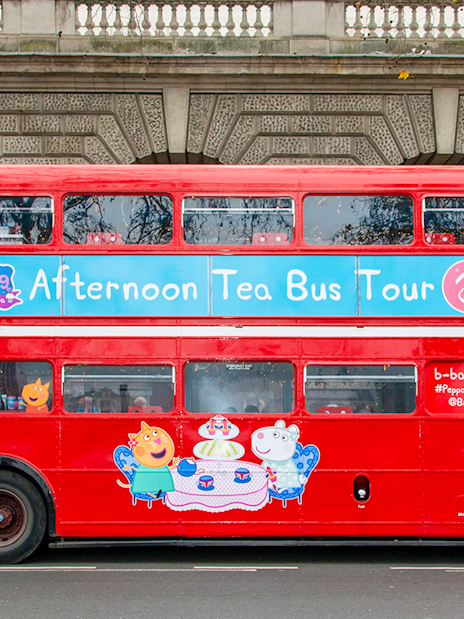 Red double-decker bus for Brigit’s Afternoon Tea Bus Tour with Peppa Pig theme.
