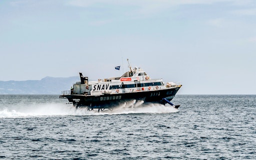 SNAV ferry traveling between Naples and Ischia on open sea.