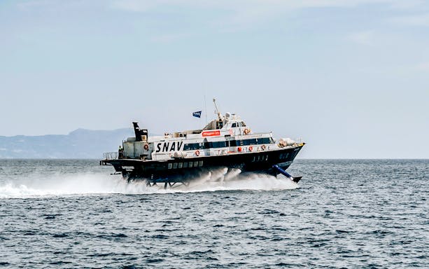 SNAV ferry traveling between Naples and Ischia on open sea.