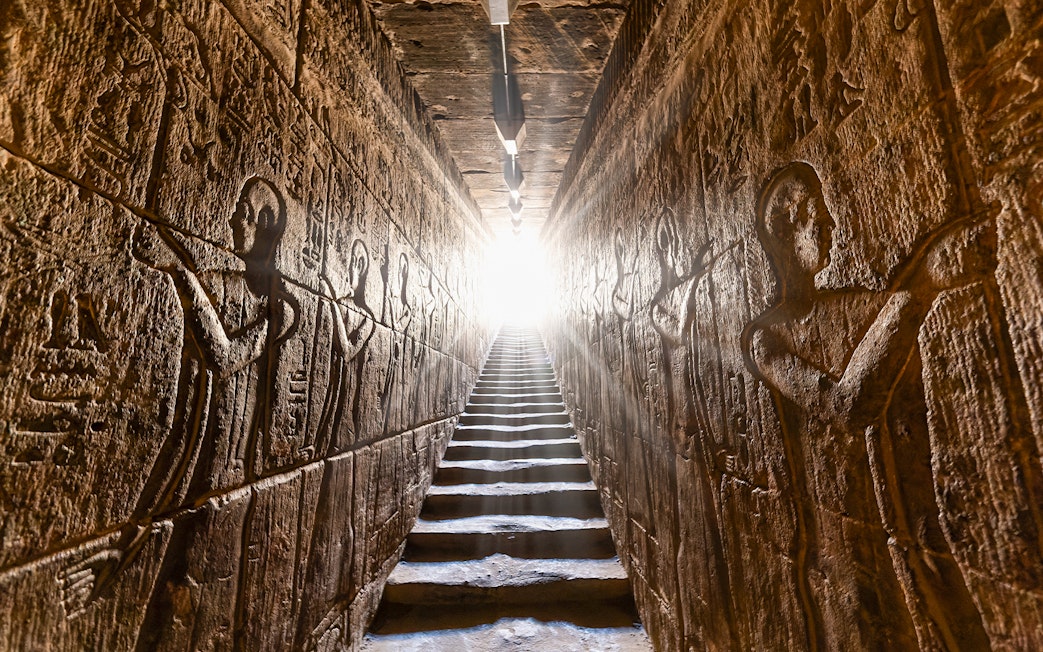 Hieroglyphic carvings on passage walls inside Temple of Horus, Edfu, Egypt.