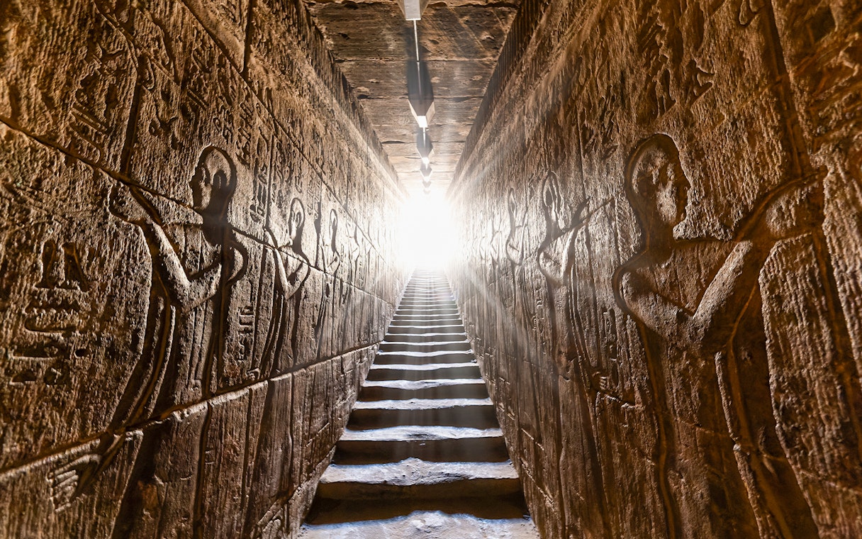 Hieroglyphic carvings on passage walls inside Temple of Horus, Edfu, Egypt.
