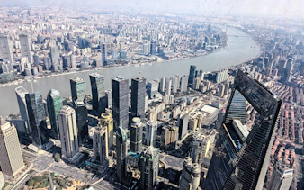 Aerial view of Shanghai skyline with the Shanghai Tower and Huangpu River.