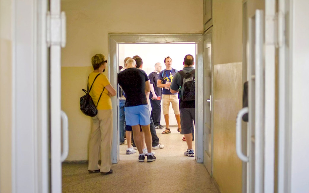 Guests with a tour guide inside Sachsenhausen Concentration Camp Memorial.