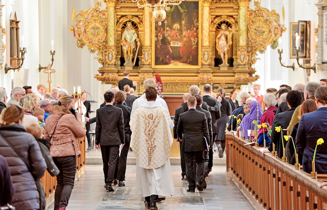 Vatican City St. Peter's Basilica interior during mass with attendees seated