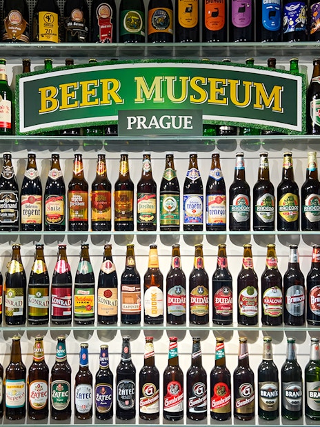 Beer bottles displayed inside Prague Beer Museum.